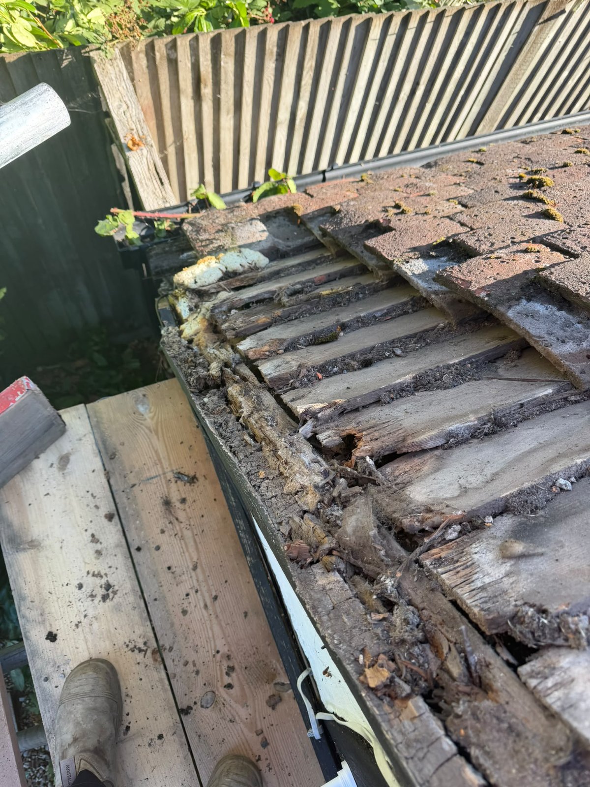 A roof stripped back ready for re-roofing by J P Building Services