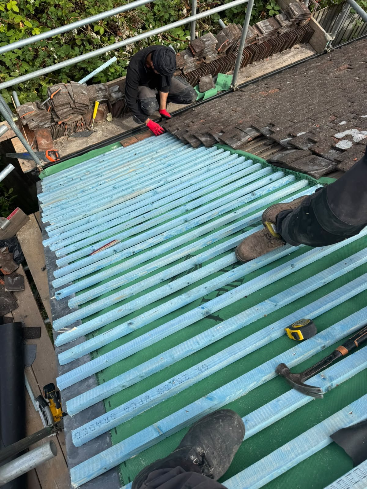 New roofing sheets being fitted by J P Building Services