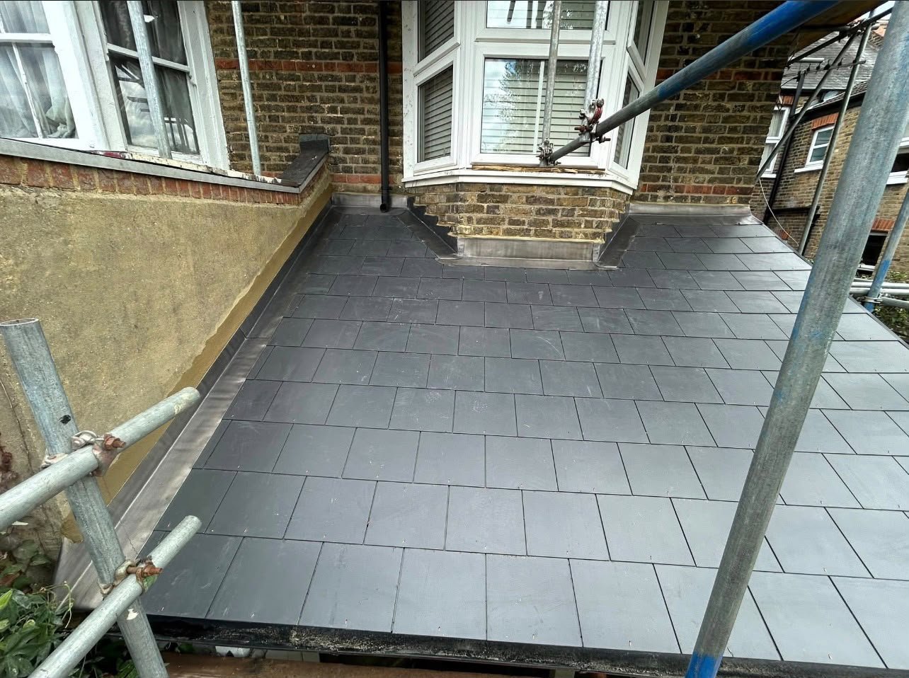 A completed slate flat roof by J P Building Services