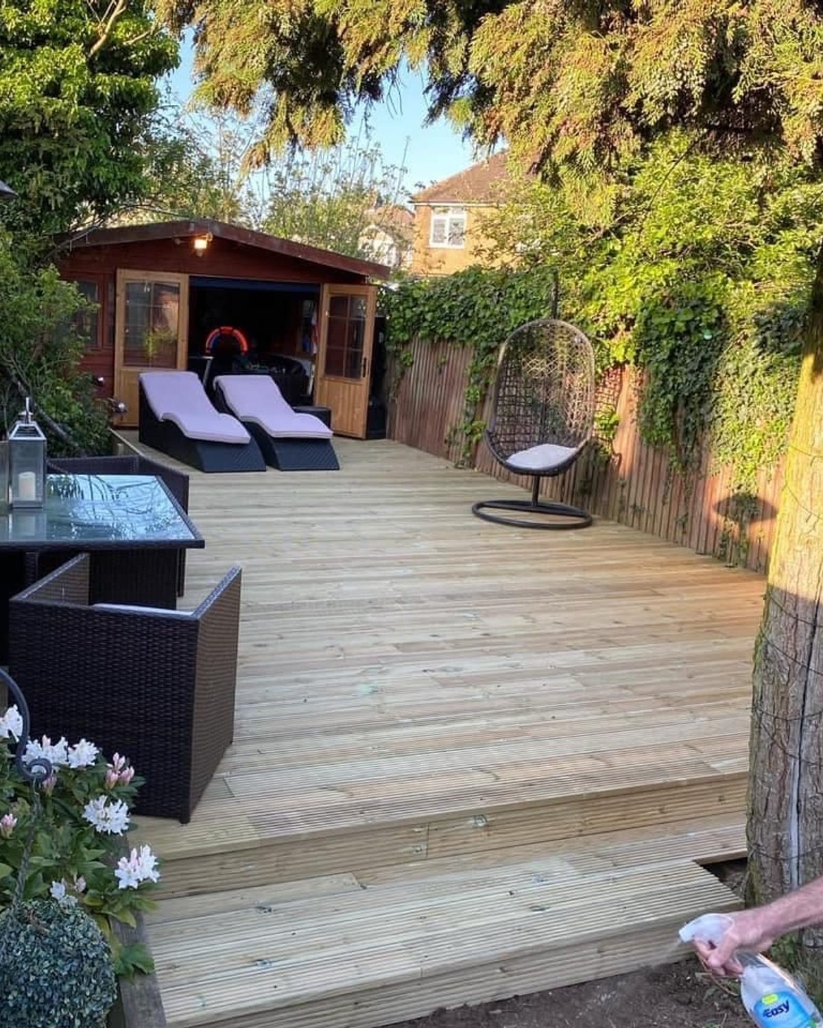 A renovated garden with lawn, patio and planting