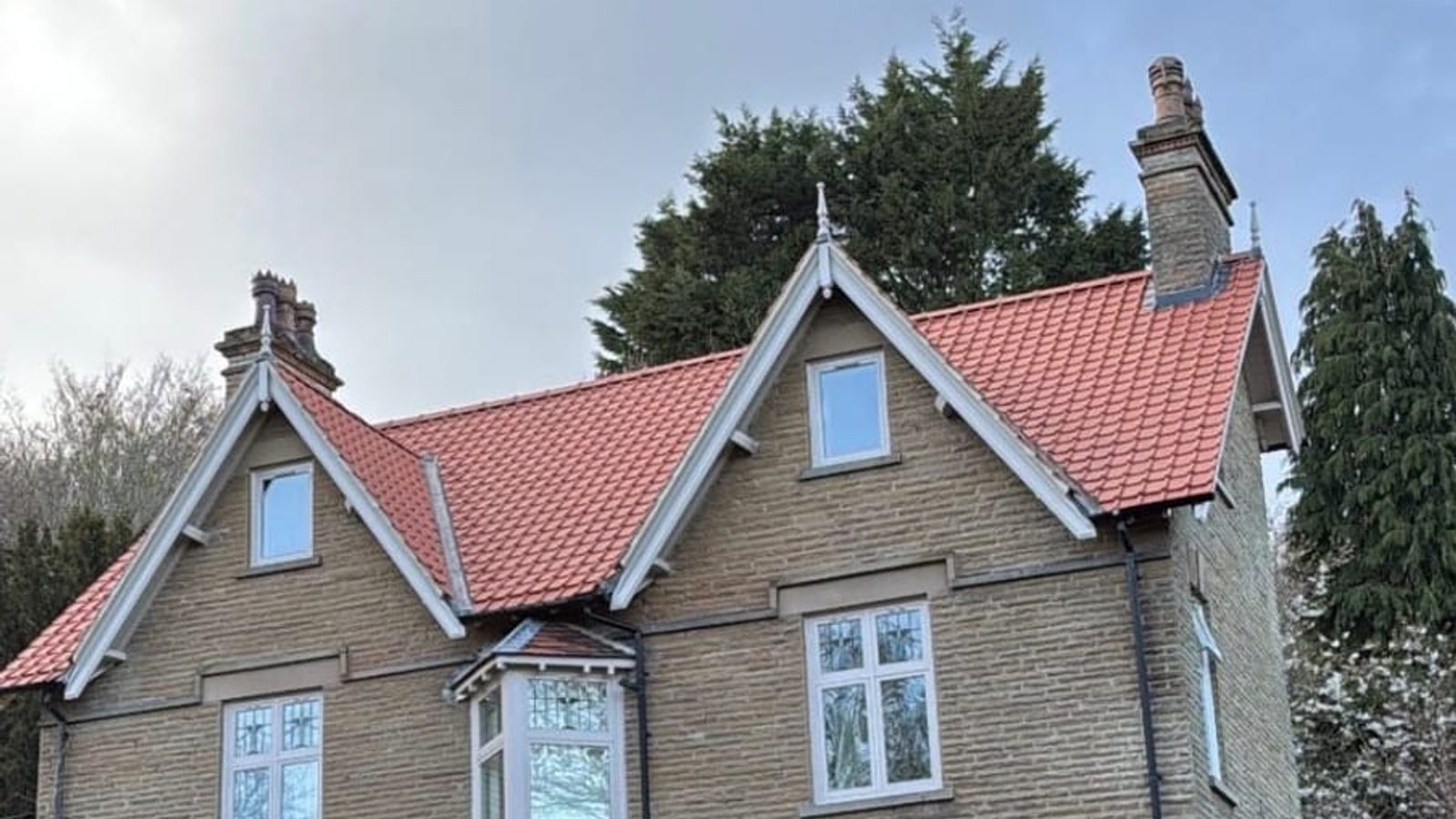 A newly tiled pitched roof on a house