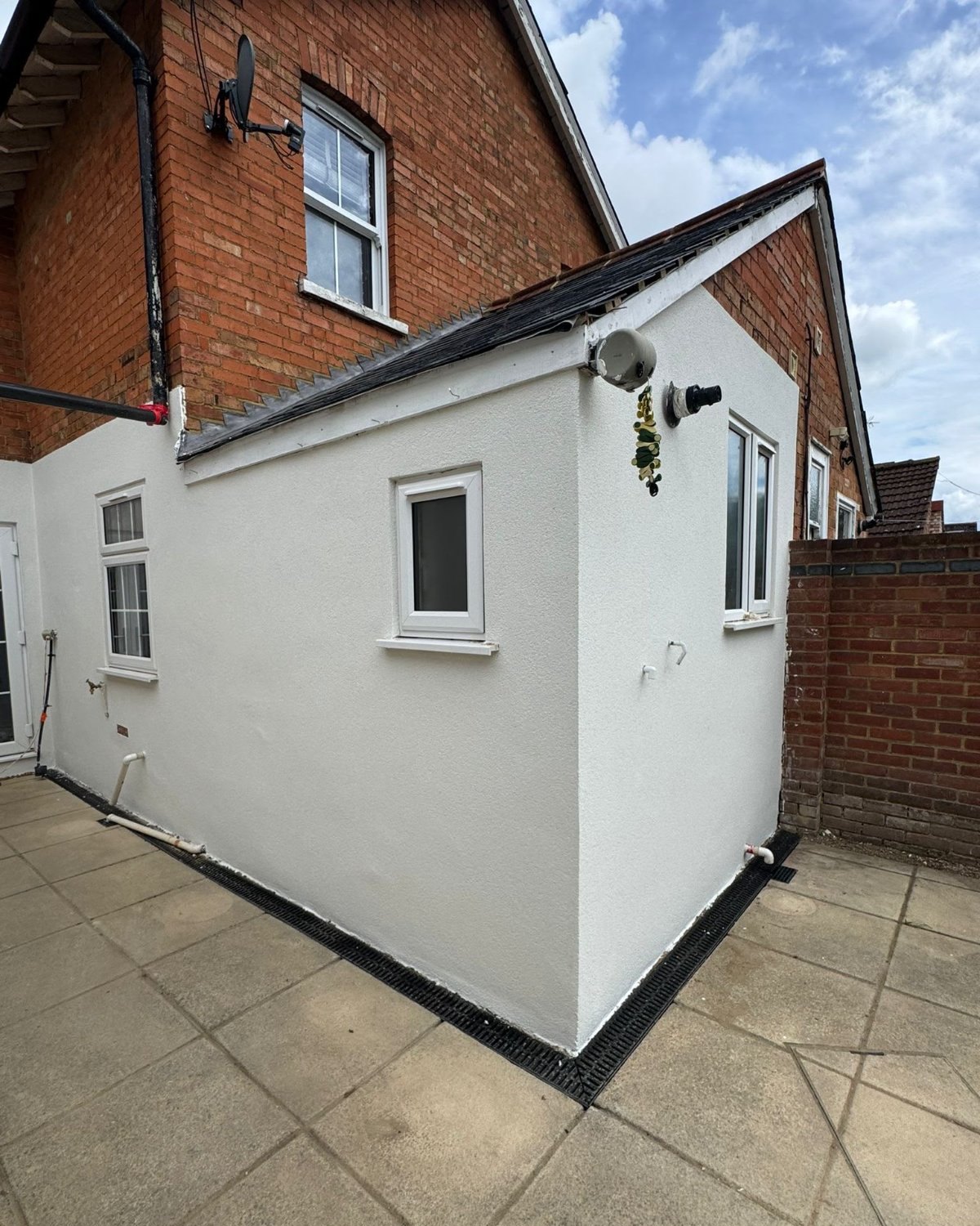 A rendered house exterior finished in a smooth coat
